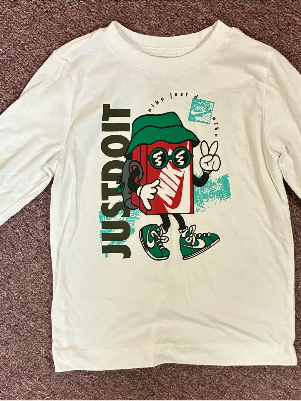 Nike White Long-Sleeve Tee with Colorful 'Just Do It' Character Graphic